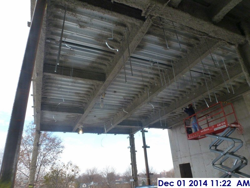 Installing ductwork hangers at the 3rd floor Facing North